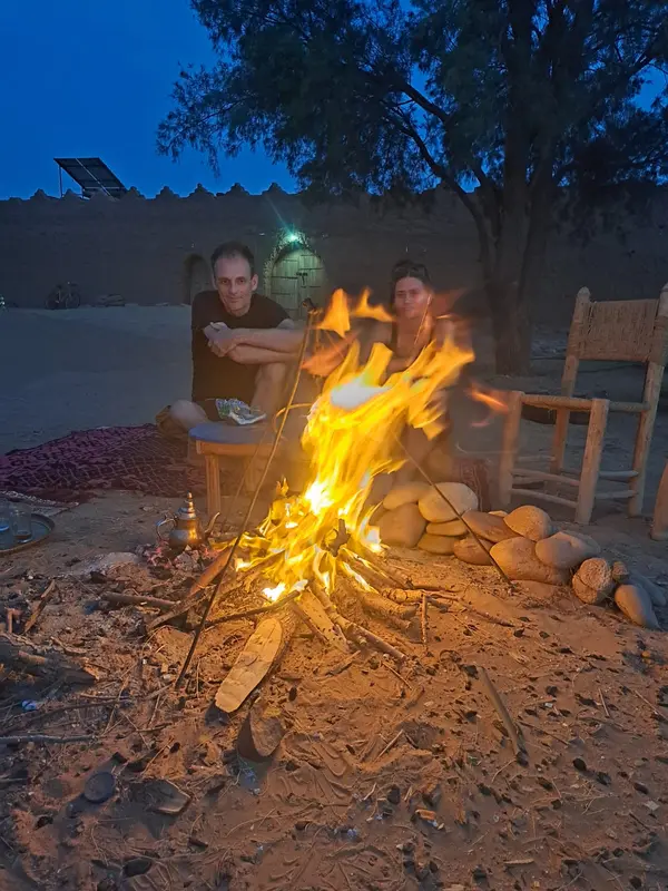 Travellers around the campfire