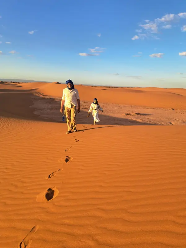 Couple walking in the dunes
