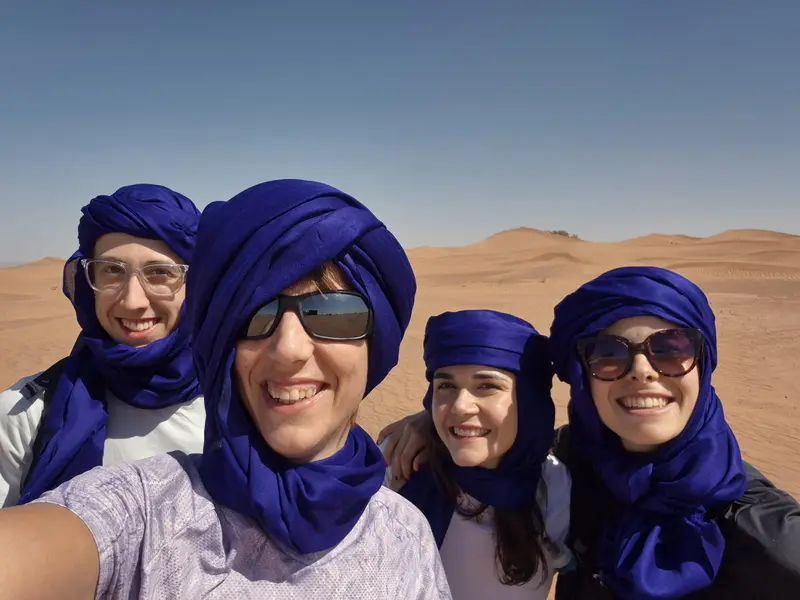 Travellers wearing blue desert scarves